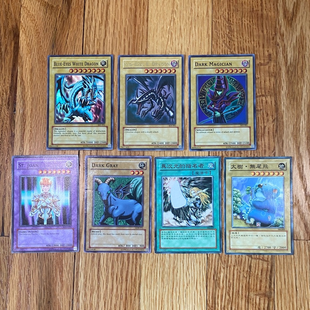 Lot of 7 Yu-Gi-Oh Cards: First Edition Blue-Eyes, Red-Eyes, and Dark Magician